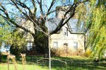 Abandoned yellow brick Ontario farmhouse in Lambton County